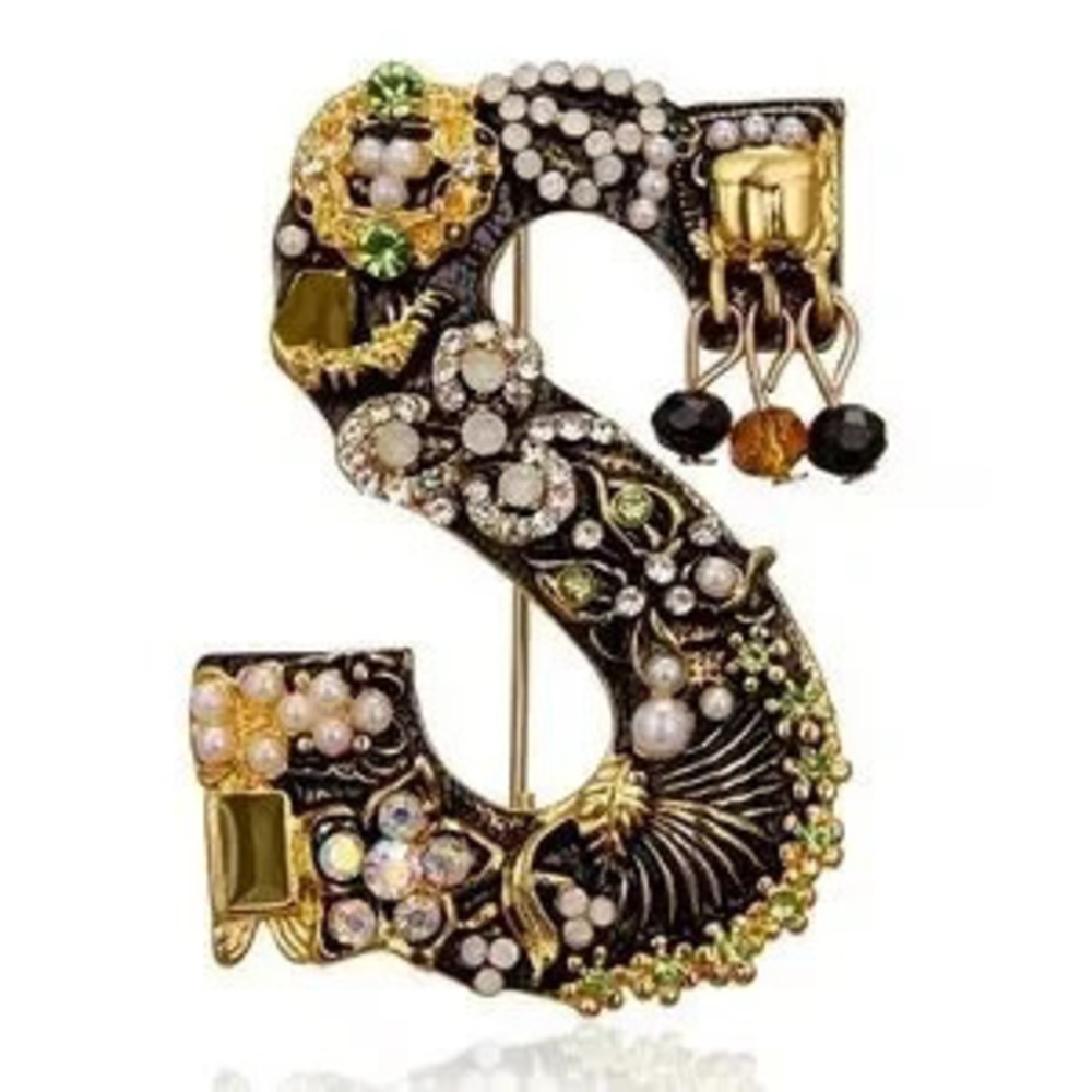 Elegant Gold and Black Brooch with Crystal Accents